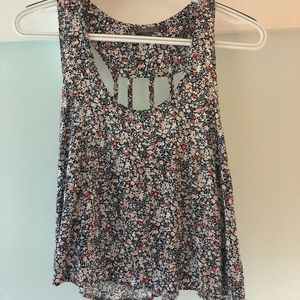 Charlotte Russe floral tank with openings on back